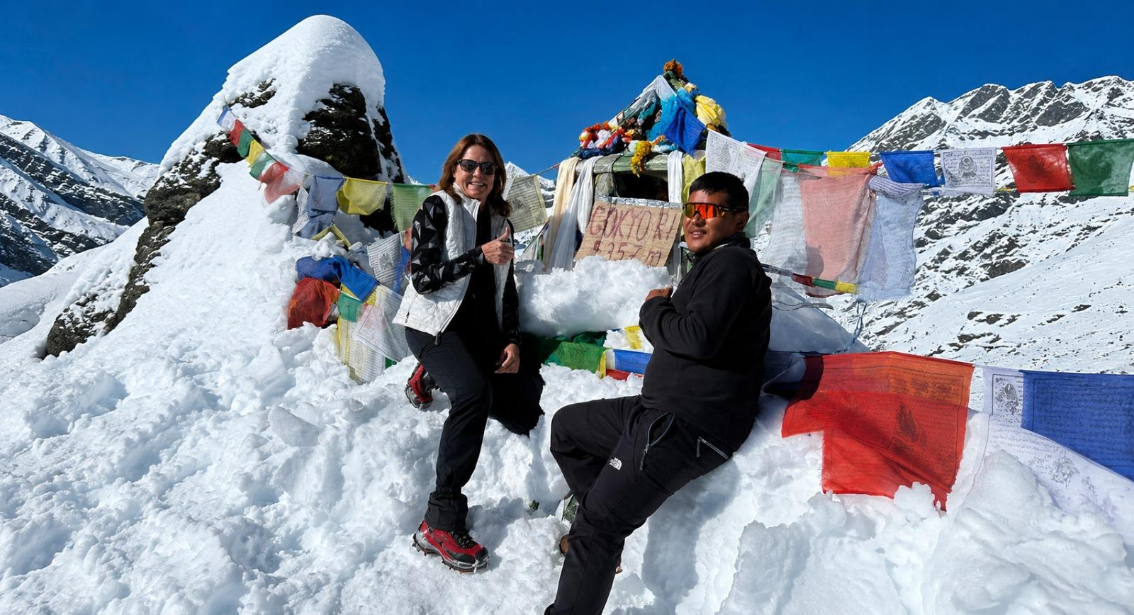 Trekkers standing on the Gokyo Ri summit at 5,357 m overlooking Mount Everest